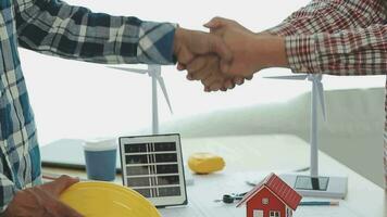 Two business man construction site engineer. Engineering objects on workplace with partners interacting on background video