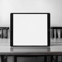 High quality photo of big tablet with blank screen on the table, perfect to create mockup preview
