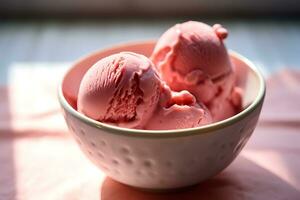 Closeup shot of a bowl with scoops of pink ice cream photo