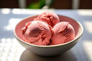 Closeup shot of a bowl with scoops of pink ice cream photo