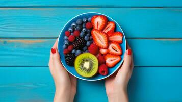 Top view of fruit salad with strawberry and blueberry sweet cherry in plate on wood background, Ai Generative. photo