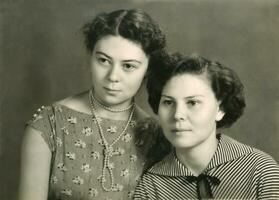 Vintage portrait of two attractive women photo