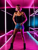 photo of beautiful woman with short hair and mixed pink neon light, generative AI