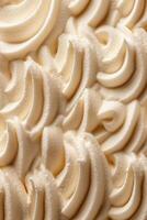 Detailed curly creamy texture of vanilla ice cream. Sweet food background. photo