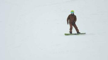 BELOKURIKHA, RUSSIAN FEDERATION FEBRUARY 21, 2017 - Athlete rides on white snow, extreme sports. Winter sports concept video
