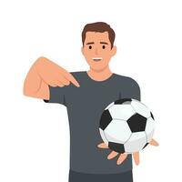 Young man holds out hand with soccer ball and points finger at it. vector