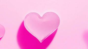 Heart shaped ice cube on a pink background. Concept of love and romance. Valentine's day ai generated photo