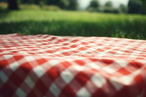 rojo y blanco tartán picnic cobija en parte superior de un verde campo en soleado día en césped de césped en verano parque. borroso antecedentes. generativo ai foto