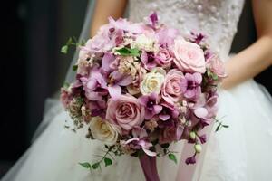 Wedding bouquet in the hands of the bride. photo