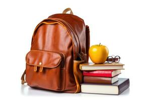 School bag and textbooks in front of a white background. Back to school concept. photo