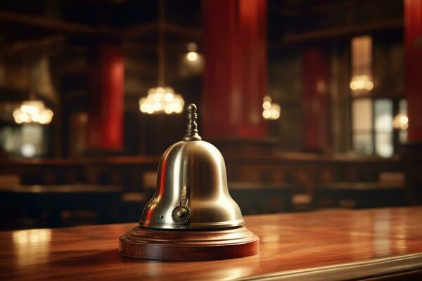 Hotel ring bell on counter desk at front reception.