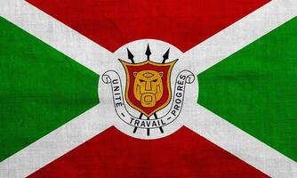 Flag and coat of arms of Republic of Burundi on a textured background. Concept collage. photo