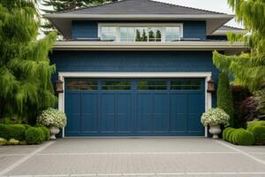 Blue garage door with a driveway in front. photo