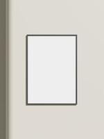 Thin rectangular frame hanging on a white textured wall mockup. photo