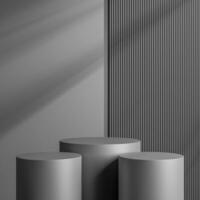 Elegant black cylinder stand for product placement mockup. Darkmetal podium exhibition scene background. Minimal platform showroom with shadow. photo