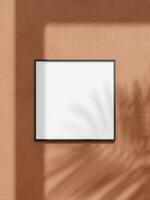 Black square frame mockup for photo, print, painting, artwork presentation, summer style decorations, leaf shadow. photo