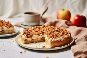 Homemade apple cake with crumble on a white table photo