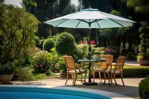 Cafe table with chair and parasol umbrella in the garden photo