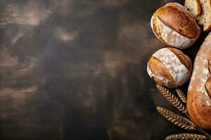 Freshly baked bread and wheat ears on rustic background. Top view with copy space. Generative AI photo