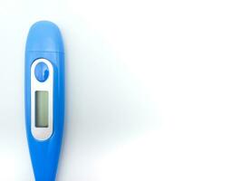 Blue Digital Thermometer Isolated On White Background. Left Position With Negative Space photo