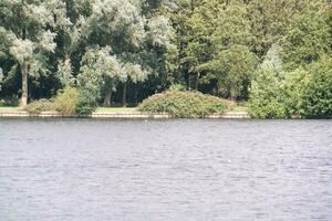 High Angle footage of People are Boating at Caldecotte Lake Located at Milton Keynes City of England Great Britain UK. The Aerial Landscape Was Captured on August 21st, 2023 with Drone's Camera photo