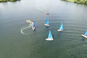 High Angle footage of People are Boating at Caldecotte Lake Located at Milton Keynes City of England Great Britain UK. The Aerial Landscape Was Captured on August 21st, 2023 with Drone's Camera photo