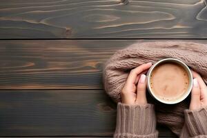 Female hands holding a cup of hot chocolate with cocoa powder on wooden background. Generative AI photo