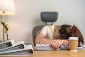 Stressed Asian woman having Tired and Sleepy while working, female businesswoman having headache at office, Exhausted woman with documents folder stack at home late night. Overworked and Overtime photo