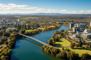 aéreo ver de el ciudad de perth, occidental Australia. mas grande ciudad de Australia. panorámico ver mirando a victoria puente terminado el waikato río como eso cortes mediante el ciudad de hamilton, ai generado foto