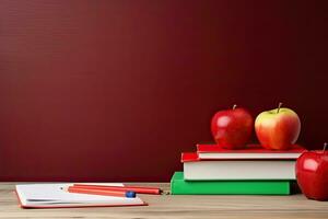 espalda a colegio concepto con libros, lapices y manzana en de madera mesa. generativo ai foto