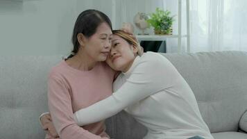 Mother day, cute asian teen girl hugging mature middle age mum. Love, kiss, care, happy smile enjoy family time. celebrate special occasion, happy birthday, merry Christmas. special day video