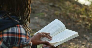 Young Black Man Reading Outsdoors Stress Reliver And Relaxing Activity video