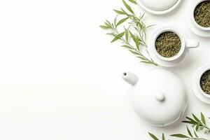 Green tea in a white teapot and cups on white background top view with copy space. Generative AI photo