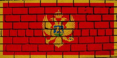 Flag of Montenegro on a textured background. Concept collage. photo