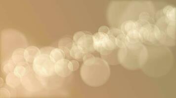 Defocused golden bokeh lights background. This elegant motion background animation with lens blur bokeh sphere particles is full HD and a seamless loop. video