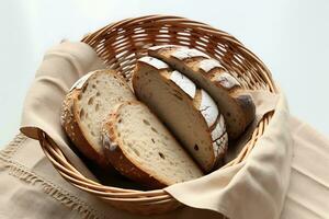 Top view of a basket with bread on the white table photo