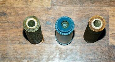 Used water filters with traces of dirt, clay and impurities. Replacing multi-stage water filter cartridges. photo