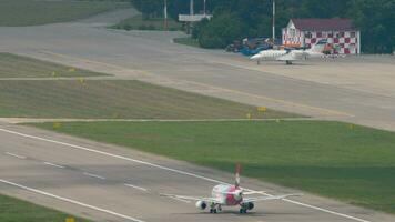 SOCHI, RUSSIA AUGUST 03, 2022 - Sukhoi Superjet 100, RA 89070 of Yamal Airlines take off at Sochi airport. Tourism and travel concept video