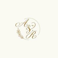 Initials AR wedding monogram logo with leaves and elegant circular lines vector