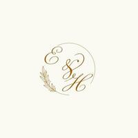 Initials EH wedding monogram logo with leaves and elegant circular lines vector