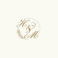 Initials HM wedding monogram logo with leaves and elegant circular lines vector