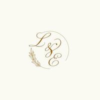 Initials LE wedding monogram logo with leaves and elegant circular lines vector