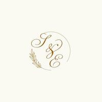 Initials SE wedding monogram logo with leaves and elegant circular lines vector