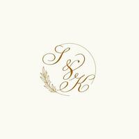 Initials SK wedding monogram logo with leaves and elegant circular lines vector