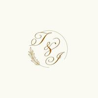 Initials TI wedding monogram logo with leaves and elegant circular lines vector