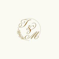 Initials TM wedding monogram logo with leaves and elegant circular lines vector