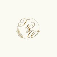 Initials TW wedding monogram logo with leaves and elegant circular lines vector