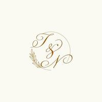 Initials TN wedding monogram logo with leaves and elegant circular lines vector