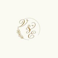 Initials VE wedding monogram logo with leaves and elegant circular lines vector