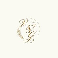 Initials VG wedding monogram logo with leaves and elegant circular lines vector